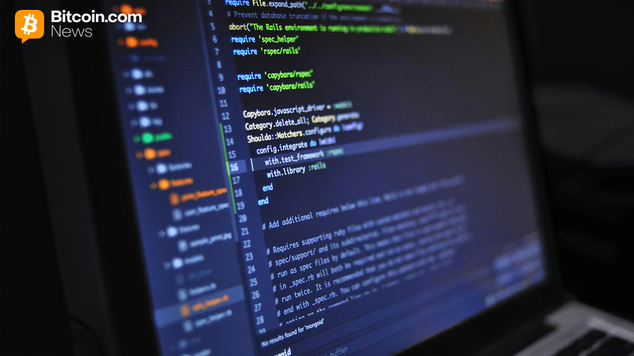 Development code on a laptop in the dark.