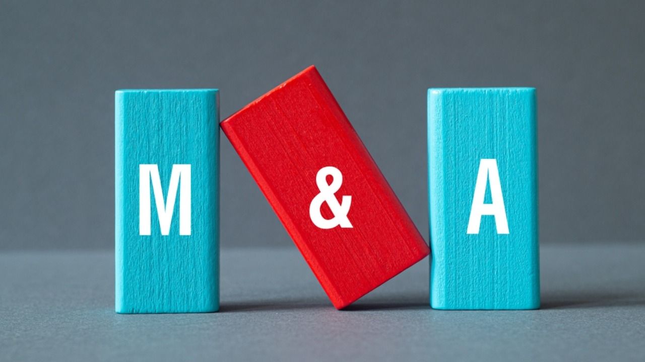 Mergers and Acquisitions, word concept on building blocks