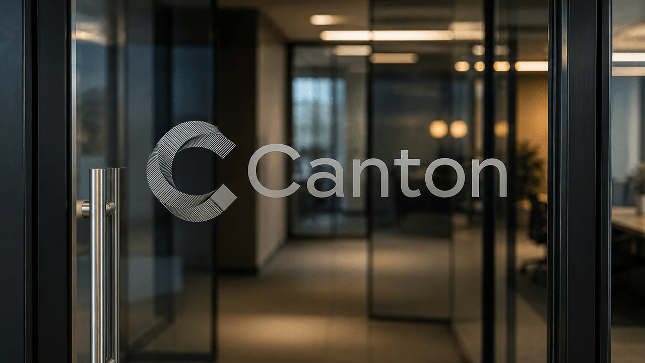 A frosted Canton logo is etched onto a modern glass office door leading into a sleek corporate workspace.