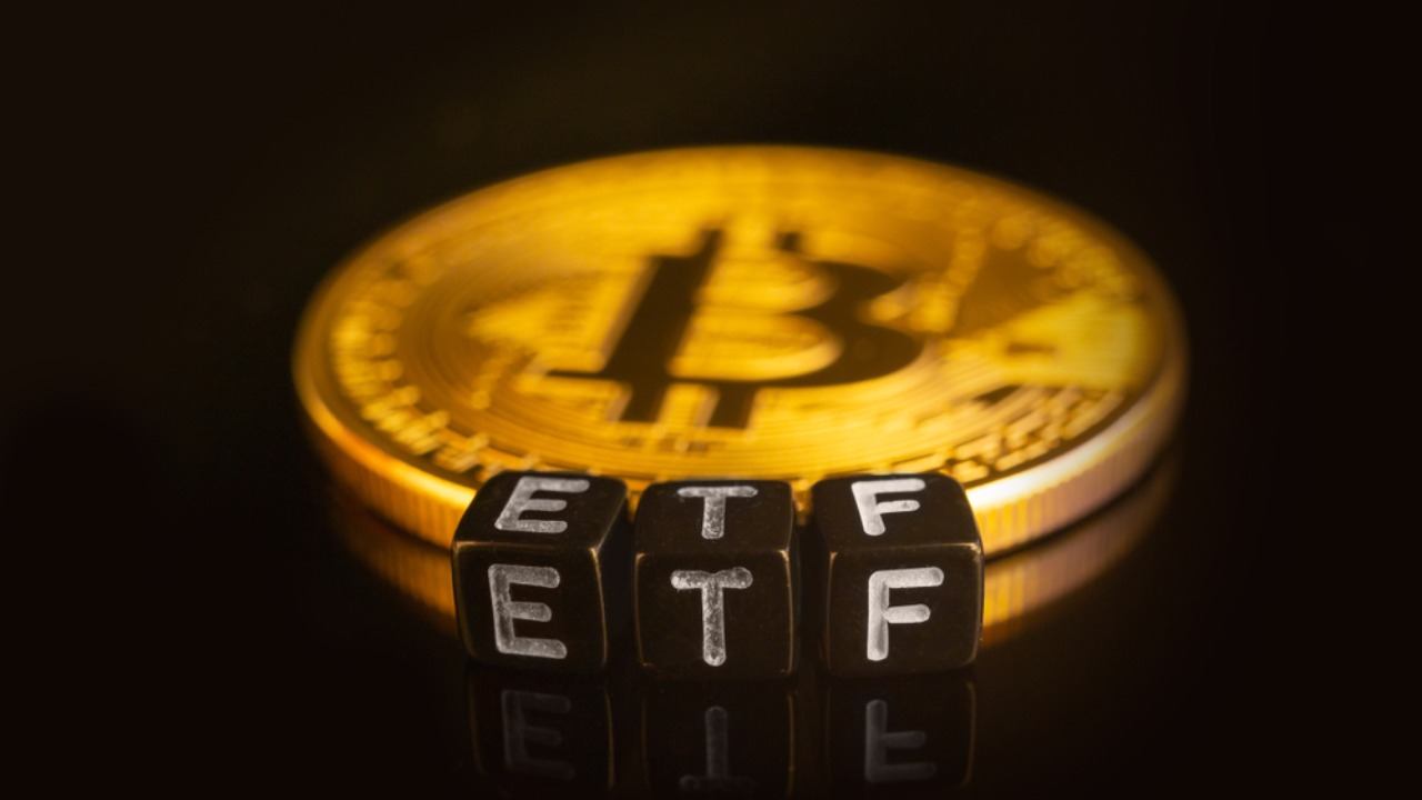 ETF written on dice with bitcoin behind it