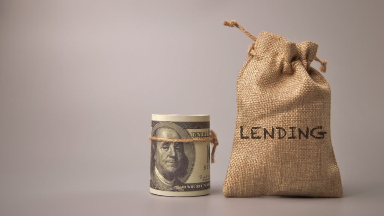 bag of coins with lending written on it