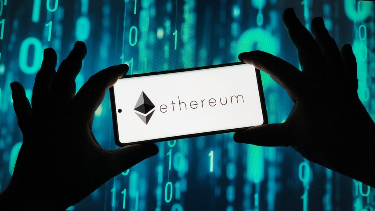 Ethereum logo on smartphone screen with binary code background