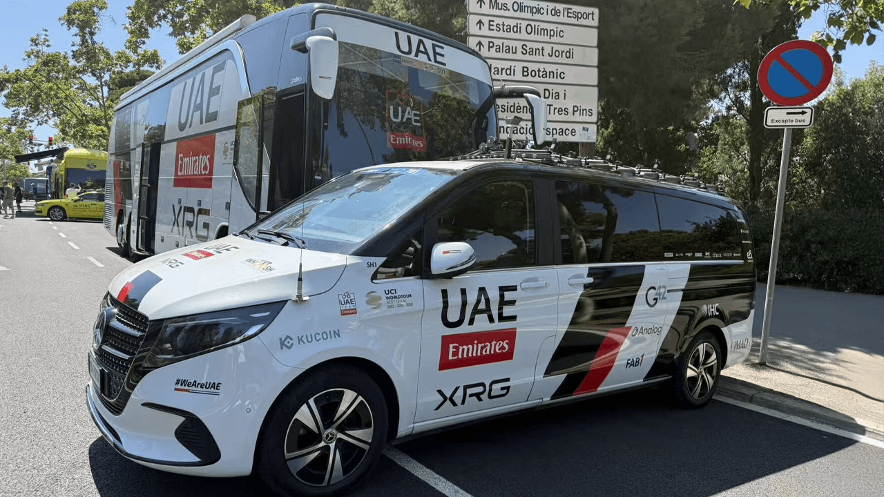 UAE Team Emirates and Kucoin branded vehicles.