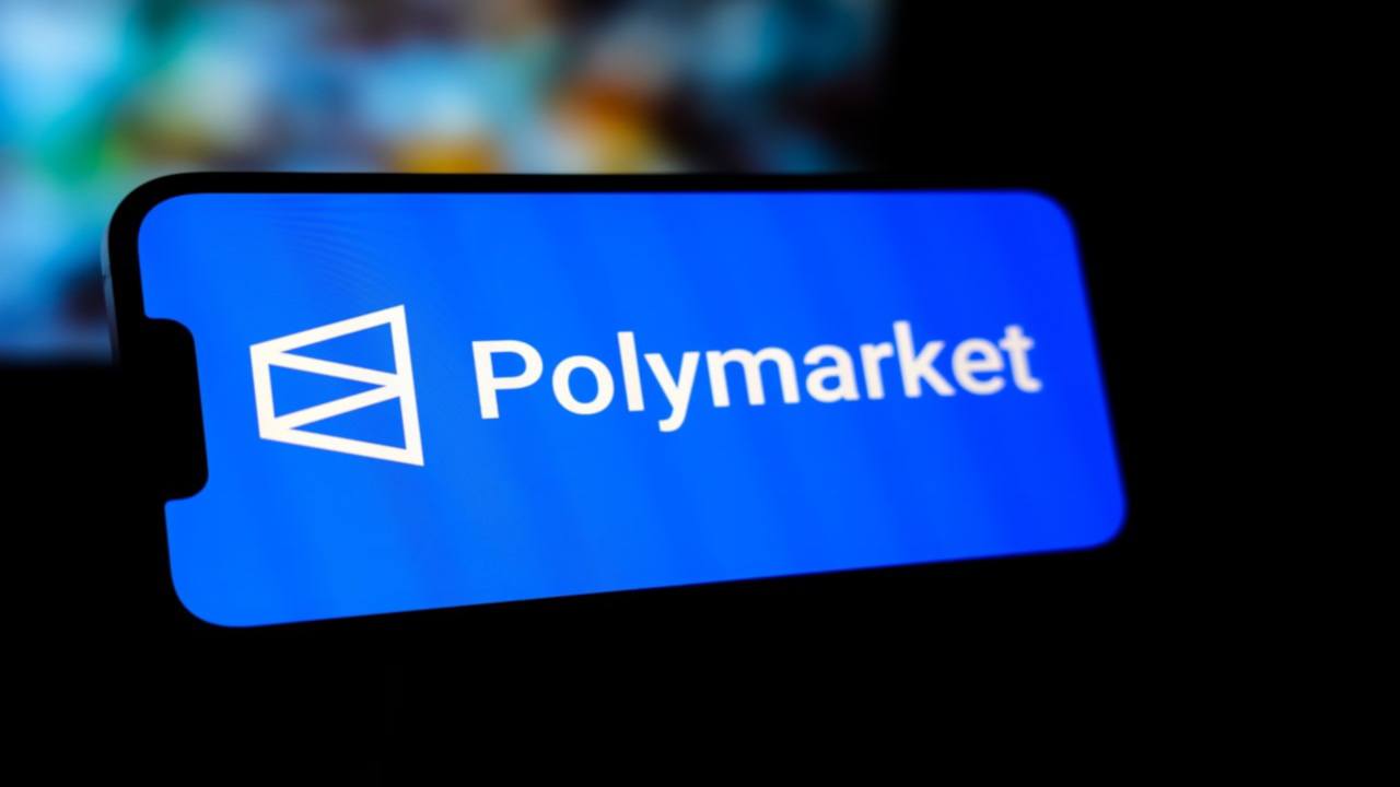 Polymarket logo on a smartphone.