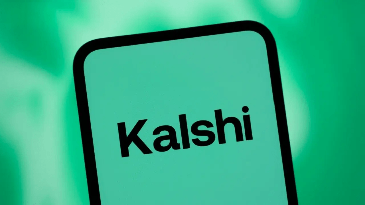 Kalshi app logo on a smartphone amidst a green backdrop.