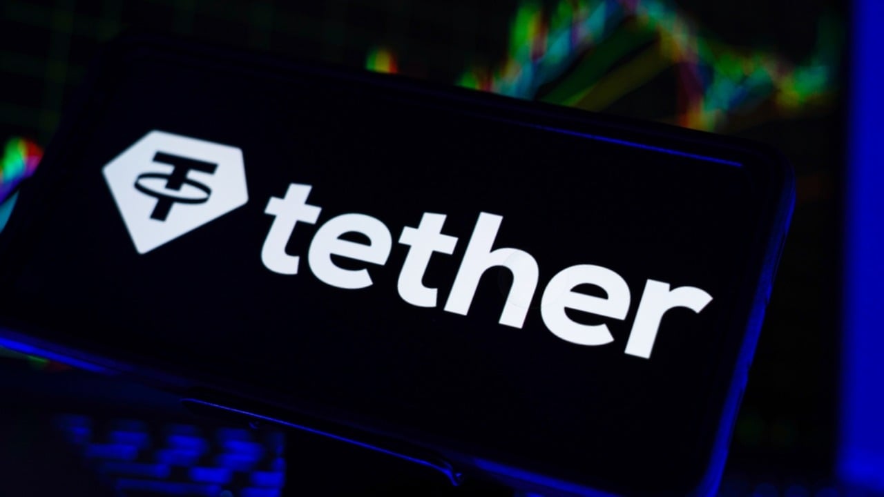 Tether on mobile phone with chart in background