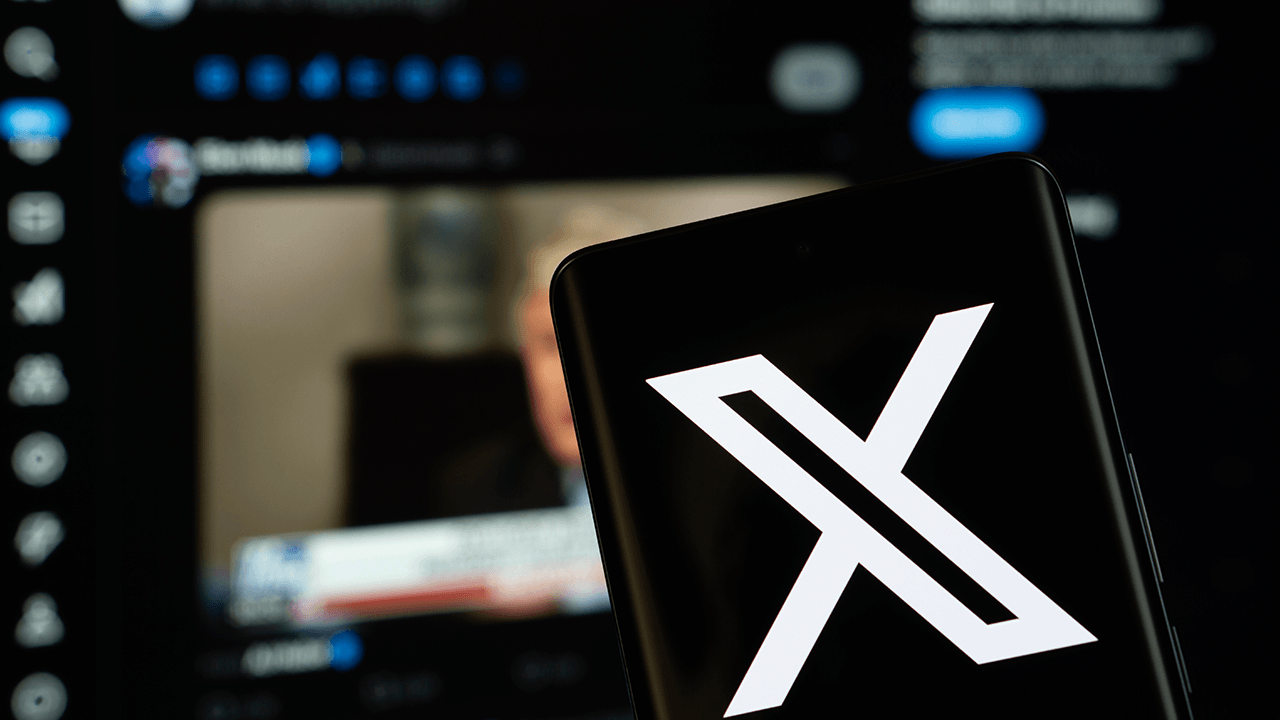 X logo on a smartphone, Shutterstock